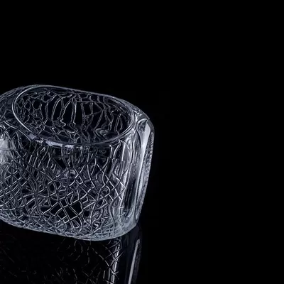 A 700ml, 750ml vodka glass bottle with a circular engraving on glass, a wine bottle with a cork seal