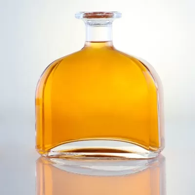 Champagne-colored 1-liter glass bottle with custom options of decal screen printing and cork seal