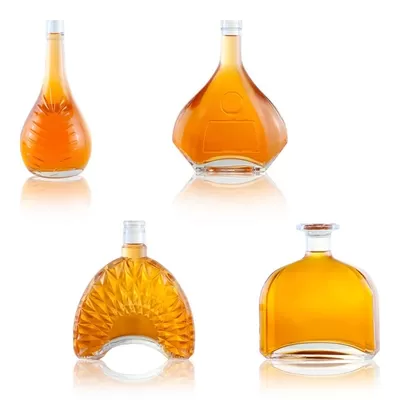 Champagne-colored 1-liter glass bottle with custom options of decal screen printing and cork seal